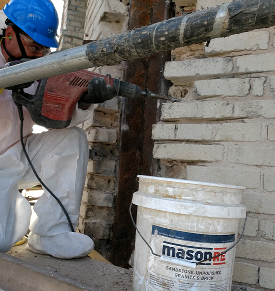 Masonry repair worker during a project